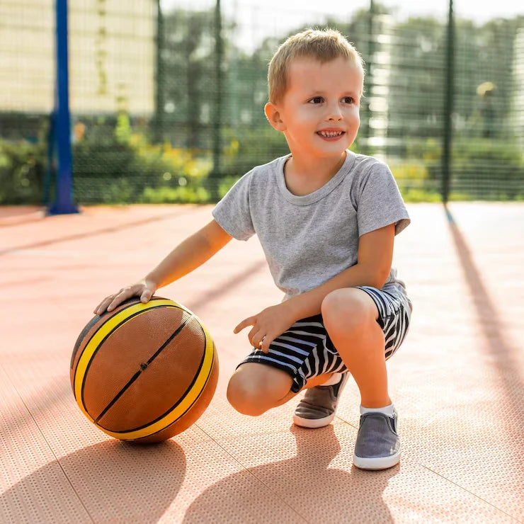 Young child playing basketball